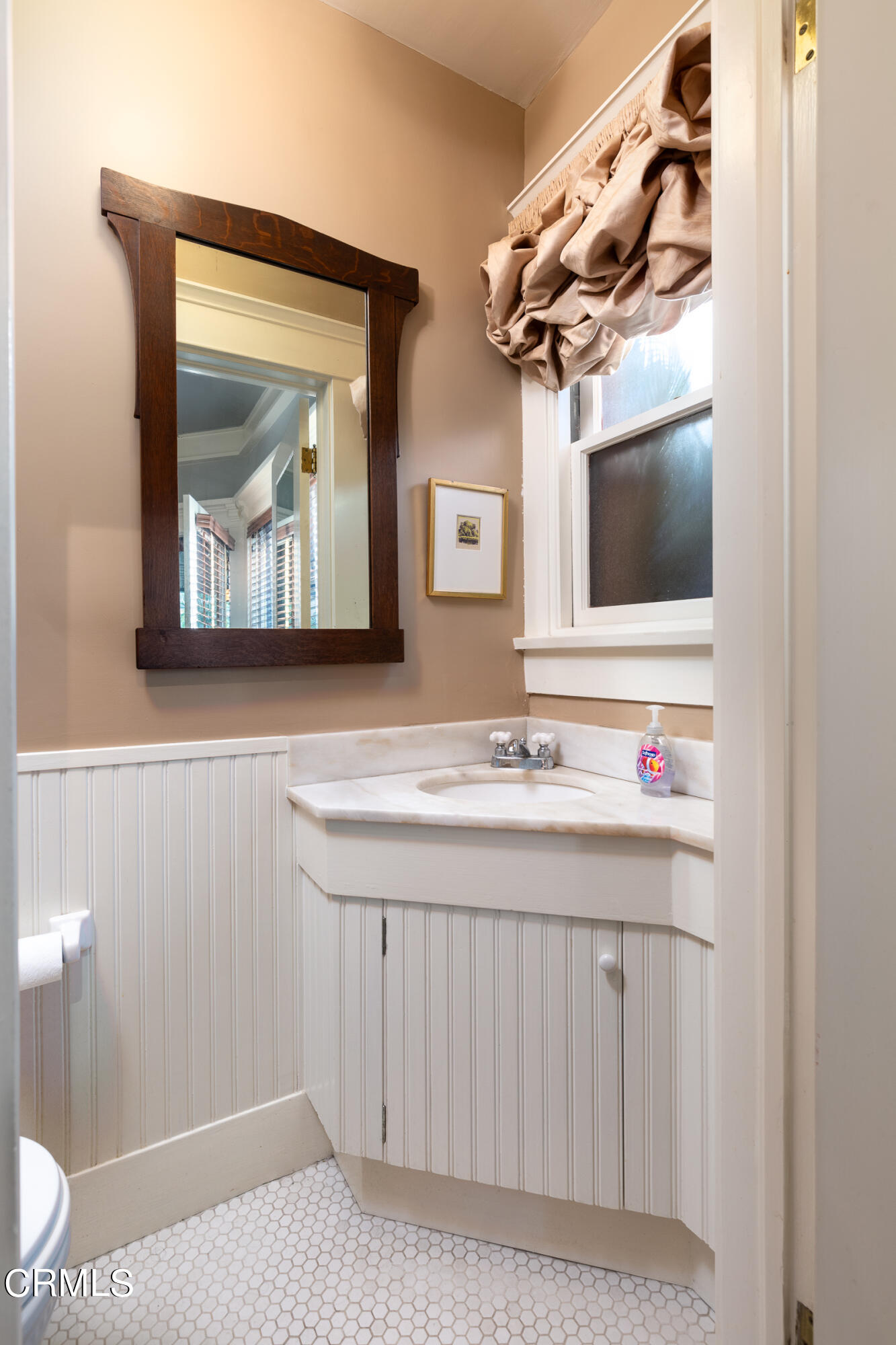 470 Bradford Street Pasadena, CA 91105 - Photo 21 of 75 a bathroom with a sink a mirror and a toilet