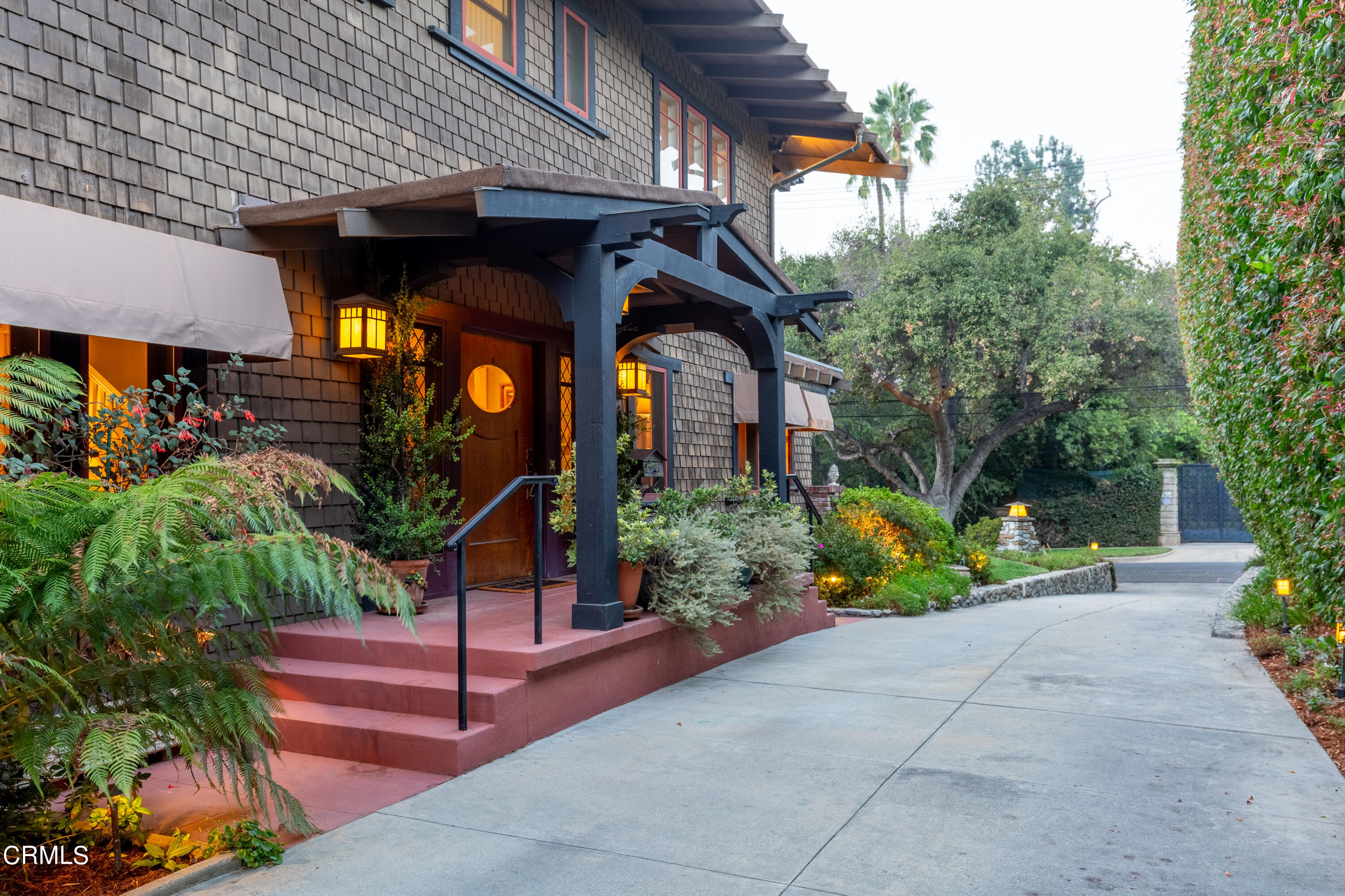 470 Bradford Street Pasadena, CA 91105 - Photo 3 of 75 a view of a house with large trees and plants