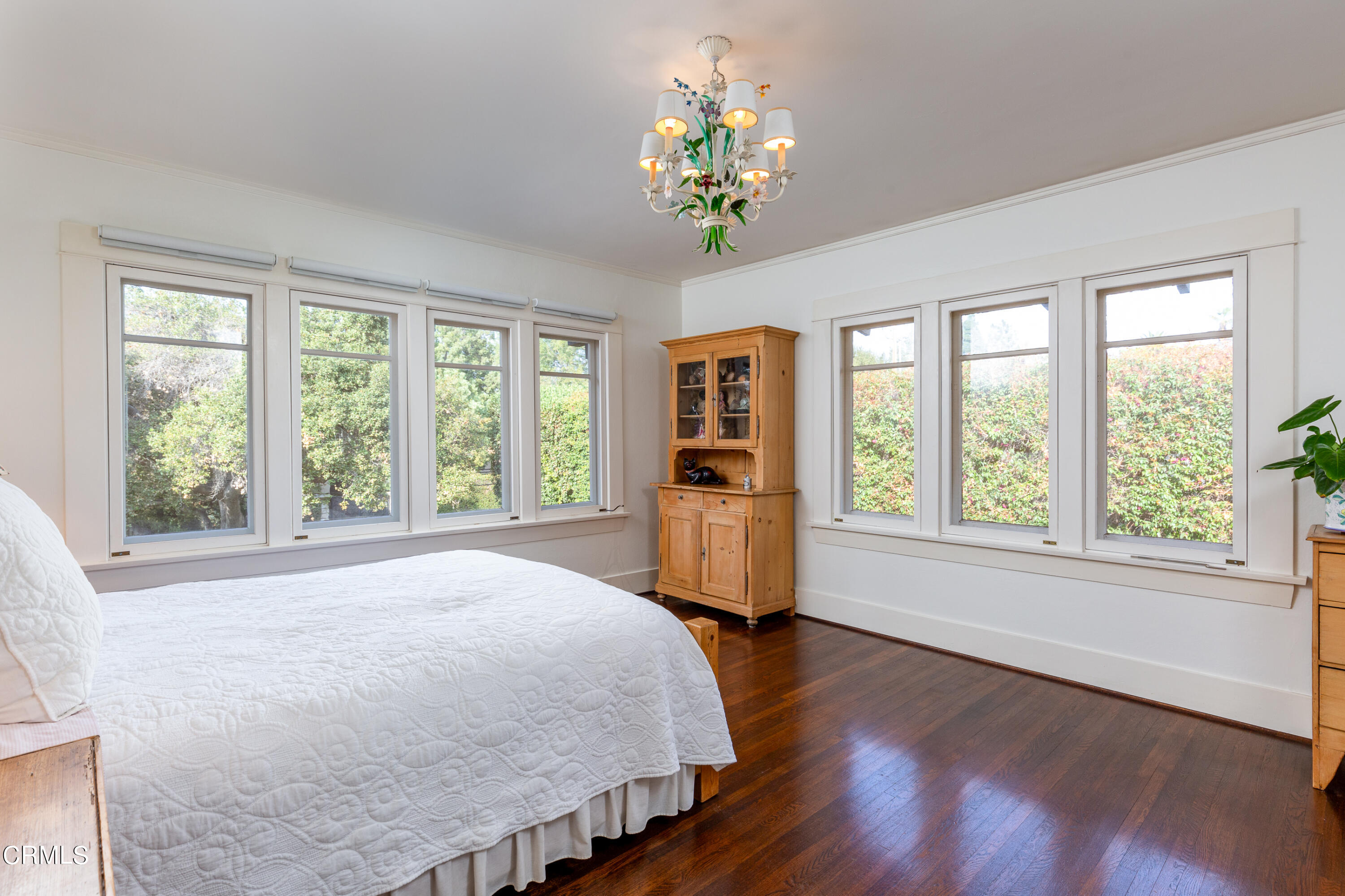 470 Bradford Street Pasadena, CA 91105 - Photo 35 of 75 a spacious bedroom with a bed and a large window with chair