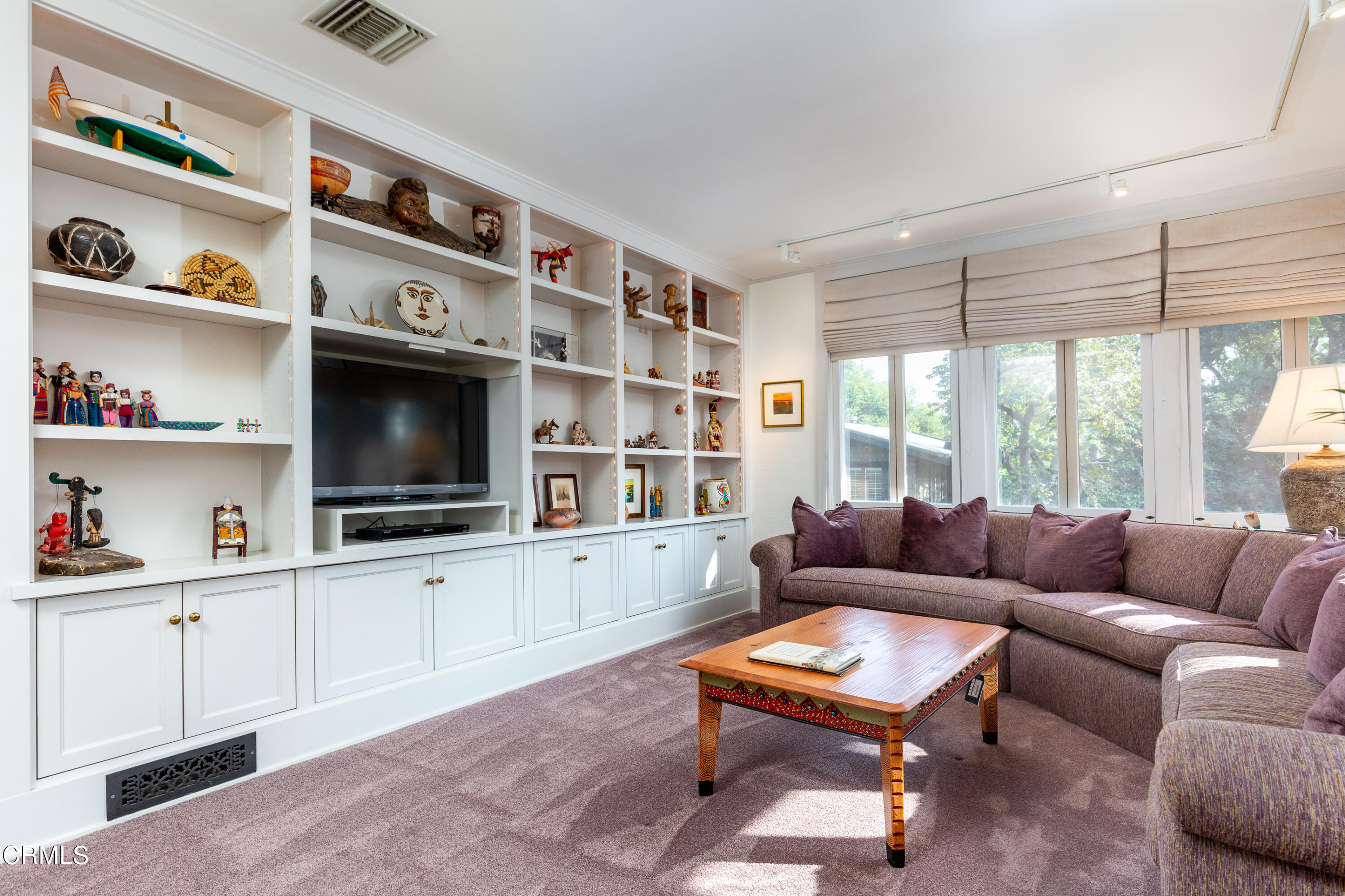 470 Bradford Street Pasadena, CA 91105 - Photo 39 of 75 a living room with furniture cabinets and a flat screen tv