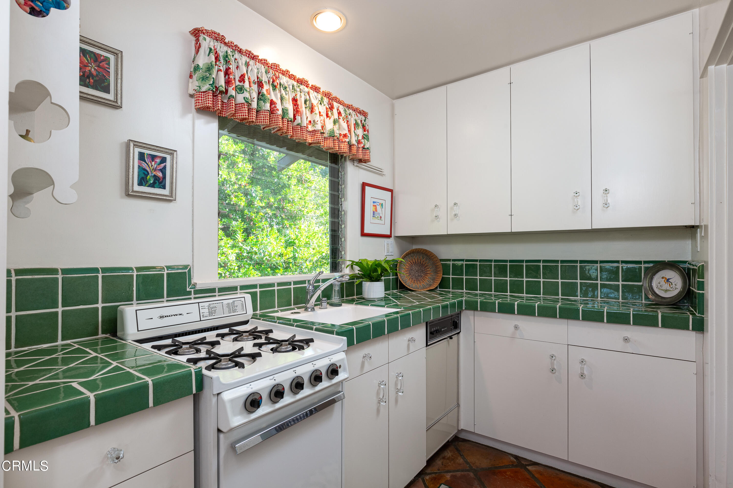 470 Bradford Street Pasadena, CA 91105 - Photo 62 of 75 a kitchen with kitchen island a stove a sink a counter space and cabinets