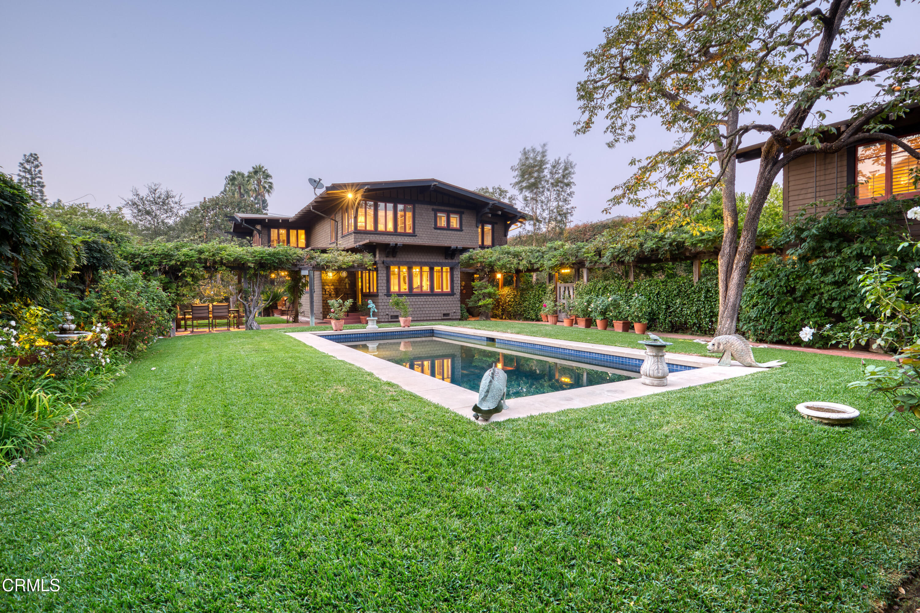 470 Bradford Street Pasadena, CA 91105 - Photo 75 of 75 a view of a swimming pool with an outdoor seating and a garden