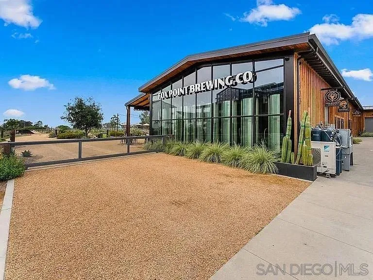 1107 Catania Court, Unit 205 Encinitas, CA 92024 - Photo 11 of 13 a view of a house with a yard