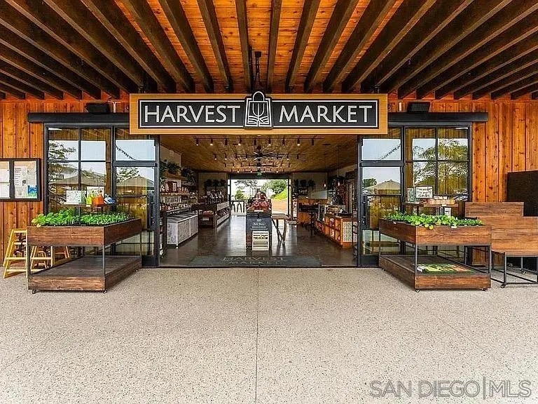 1107 Catania Court, Unit 205 Encinitas, CA 92024 - Photo 13 of 13 a view of a patio with table and chairs