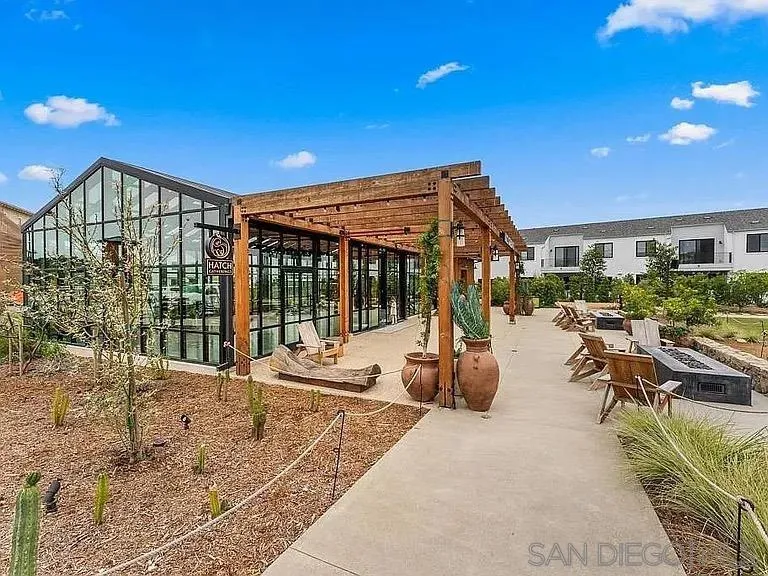 1107 Catania Court, Unit 205 Encinitas, CA 92024 - Photo 10 of 13 a view of a patio with couches and potted plants