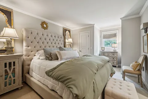 a bedroom with a bed and furniture