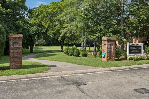 an aerial view of a houses with a yard