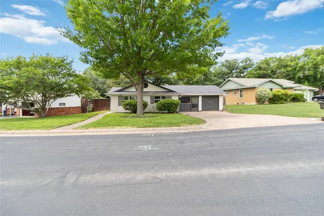 a house view with a garden space