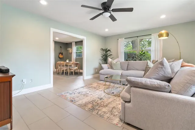 a living room with furniture and a large window
