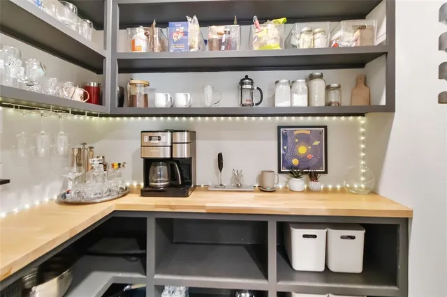 a sink with a stove and cabinets