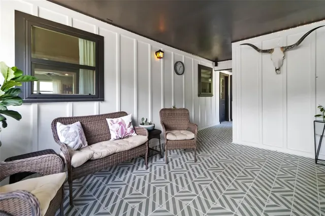 a living room with furniture and a rug