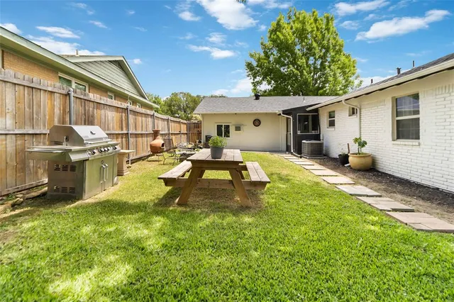 a swimming pool view with a outdoor seating