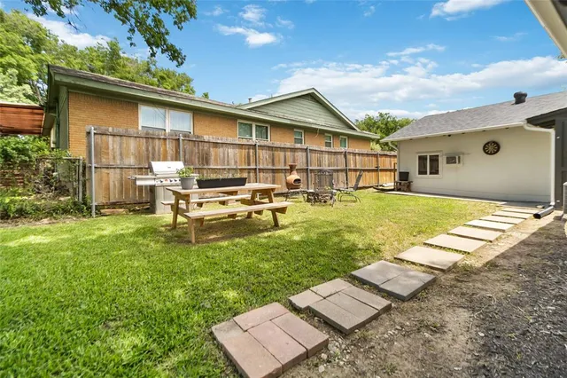 a front view of house with yard and patio