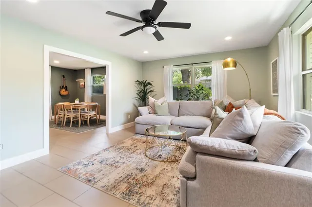 a living room with furniture and a large window