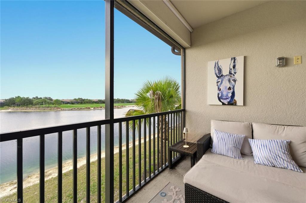 9365 Pocida Court, Unit 202 Naples, FL 34119 - Photo 27 of 40 a balcony with a couch