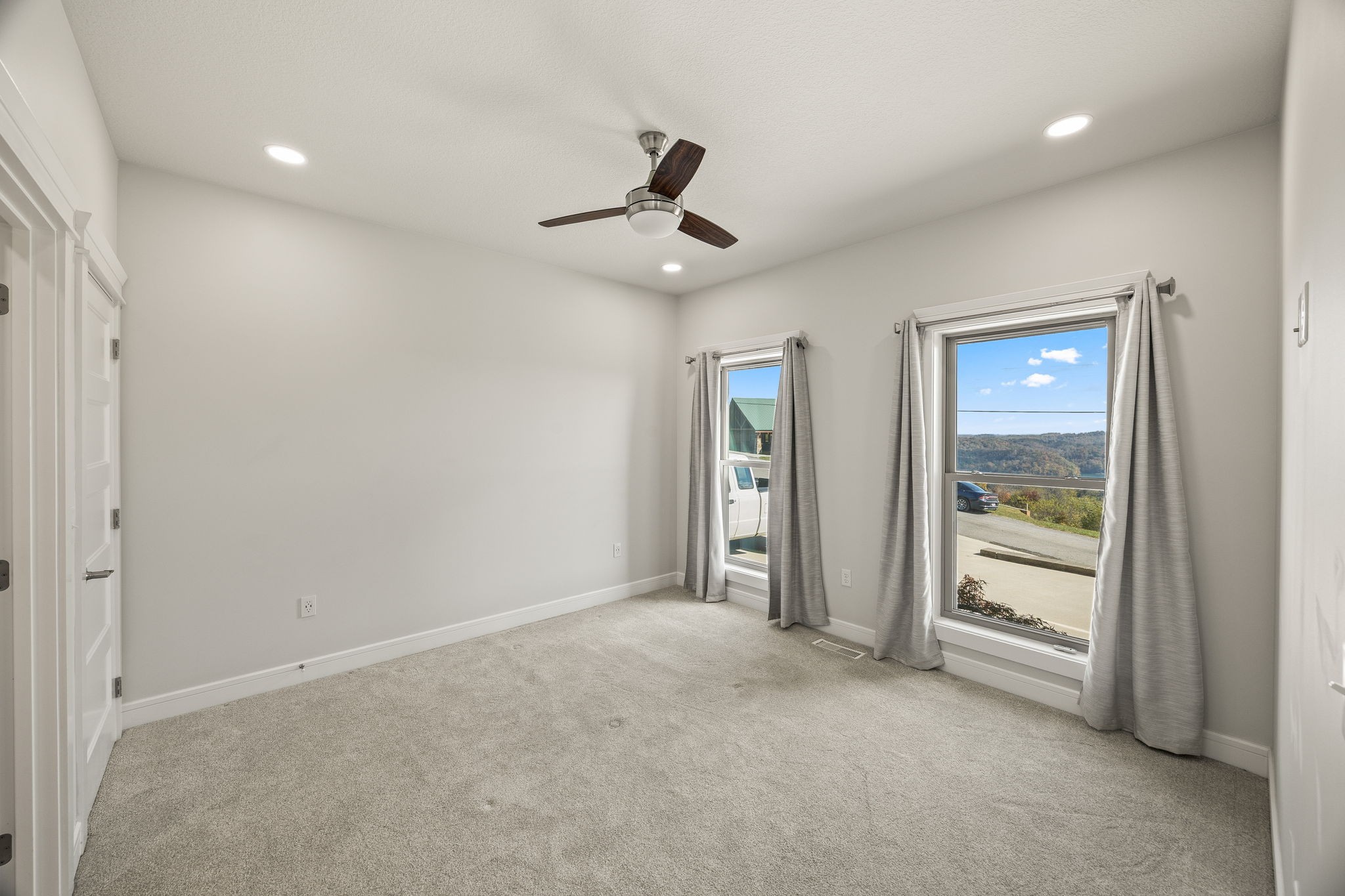 3261 Swan Ridge Road Celina, TN 38551 - Photo 11 of 28 wooden floor in an empty room with a window