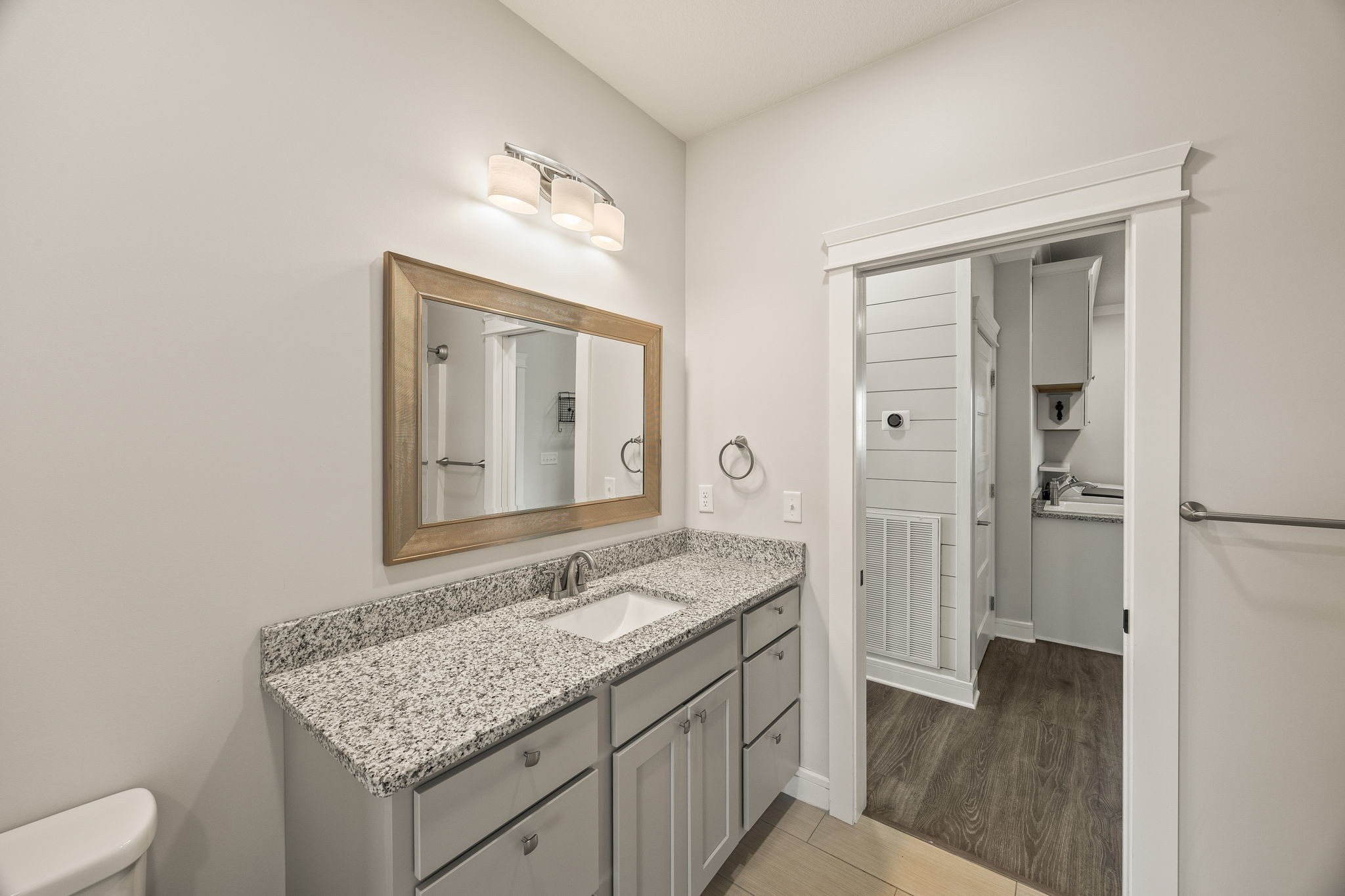 3261 Swan Ridge Road Celina, TN 38551 - Photo 12 of 28 a bathroom with a granite countertop sink and a mirror
