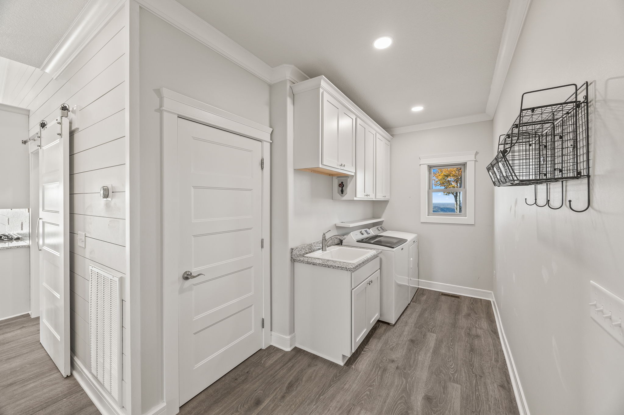 3261 Swan Ridge Road Celina, TN 38551 - Photo 16 of 28 a kitchen with a sink a refrigerator and cabinets