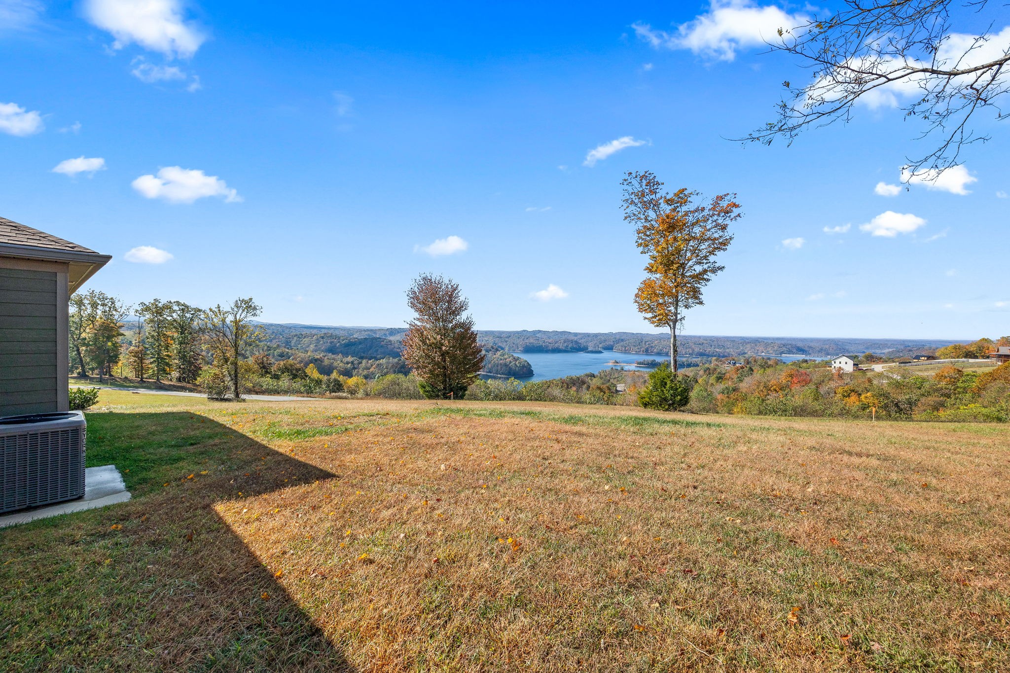 3261 Swan Ridge Road Celina, TN 38551 - Photo 22 of 28 a view of a big yard with an empty space and a lake view