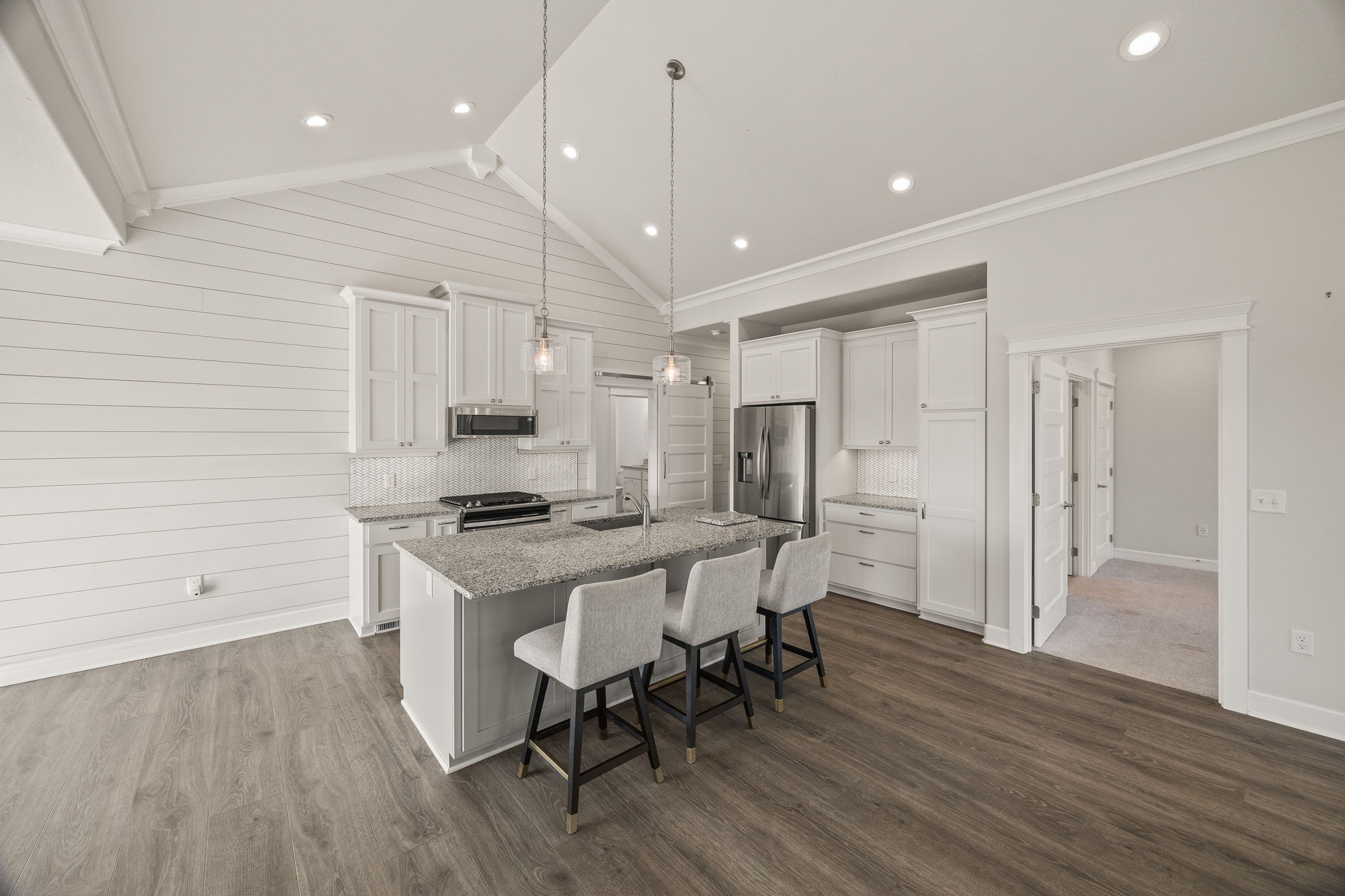 3261 Swan Ridge Road Celina, TN 38551 - Photo 4 of 28 a kitchen with a table chairs refrigerator and microwave