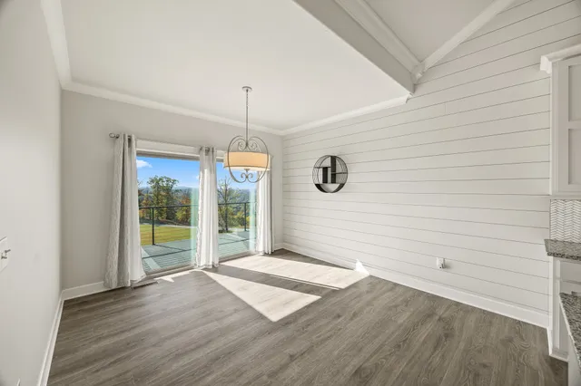 a view of a livingroom with wooden floor