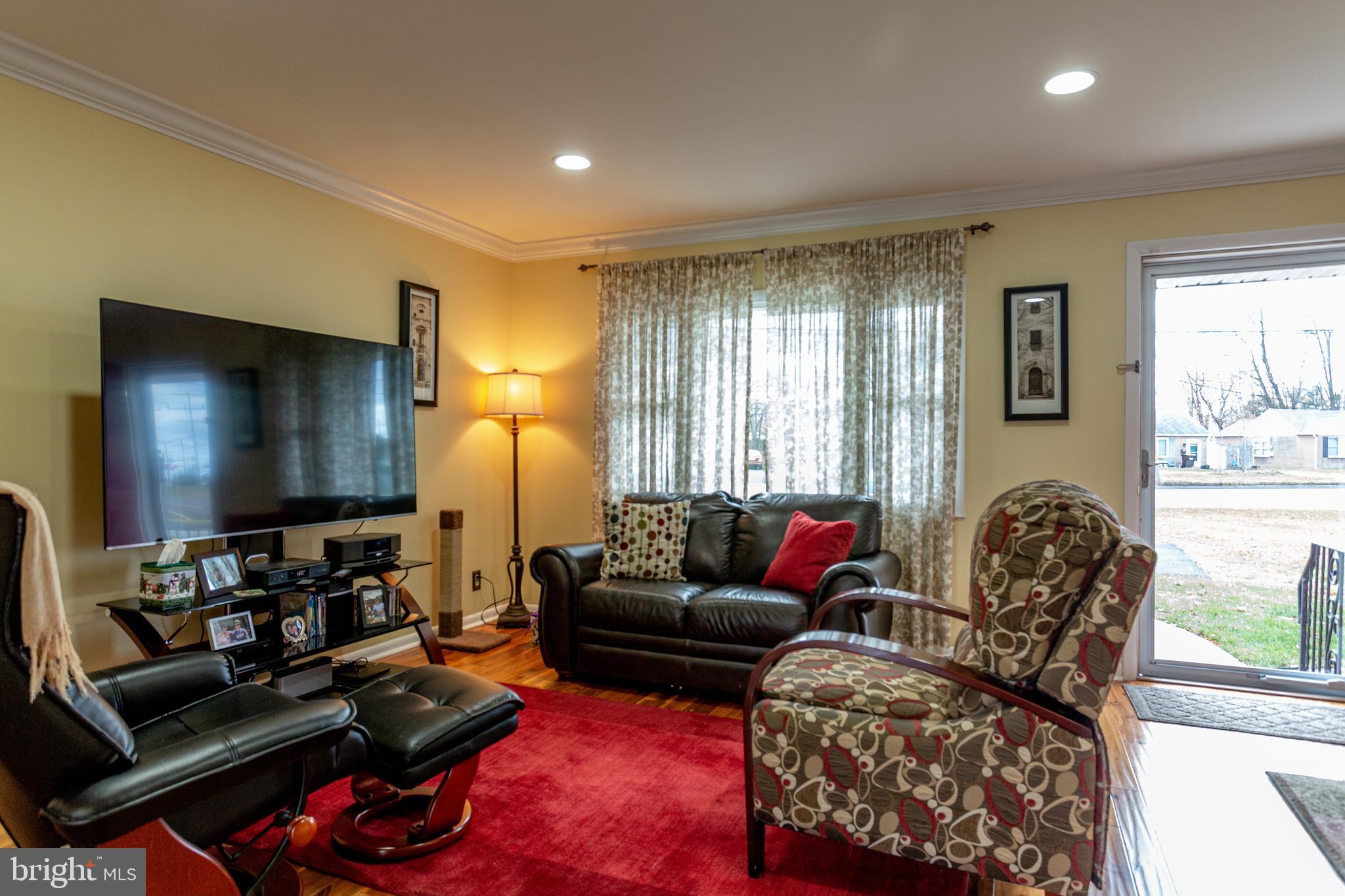 1619 West County Line Road Hatboro, PA 19040 - Photo 12 of 30 a living room with furniture and a flat screen tv