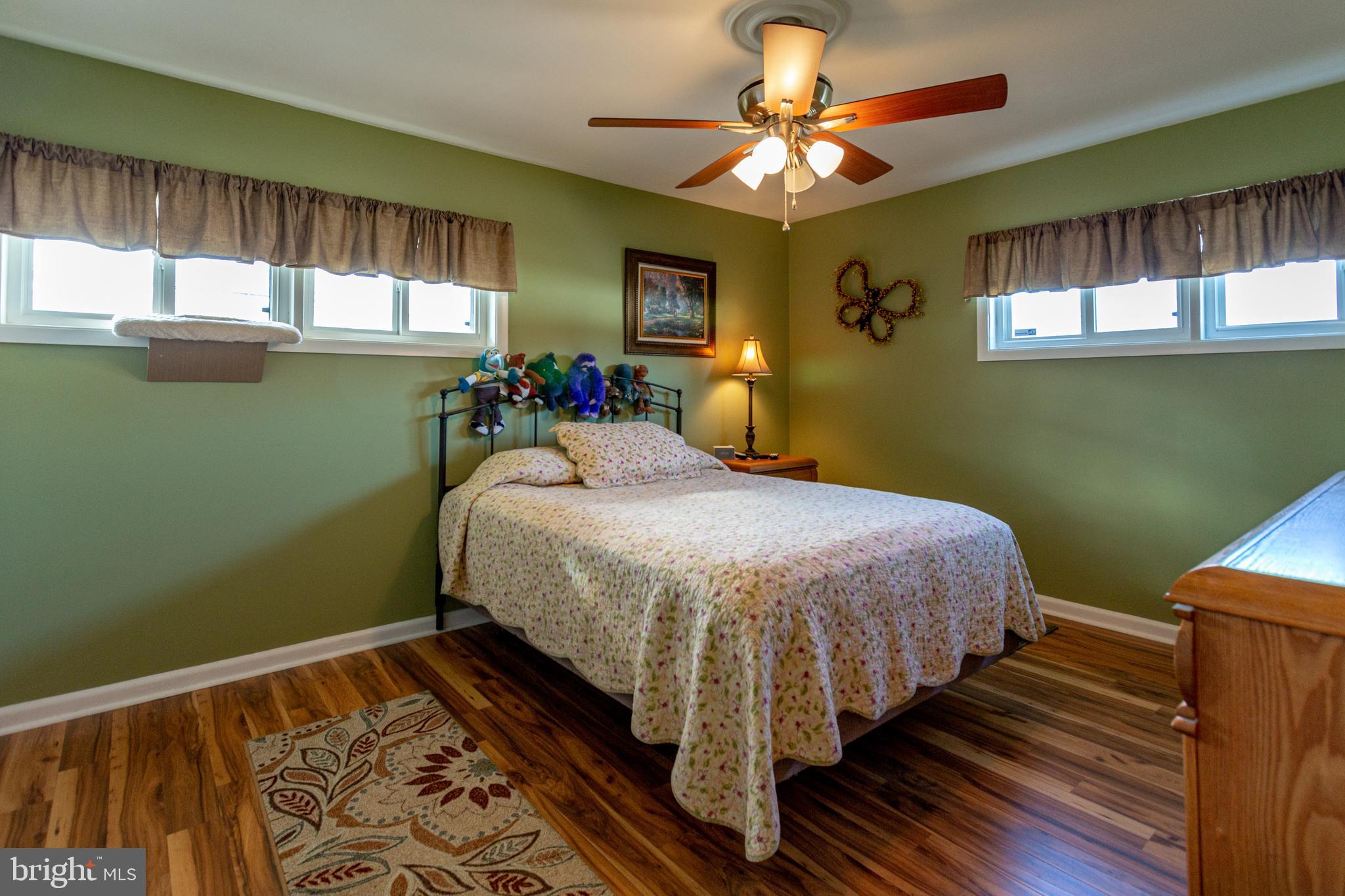 1619 West County Line Road Hatboro, PA 19040 - Photo 18 of 30 a bedroom with a bed and windows