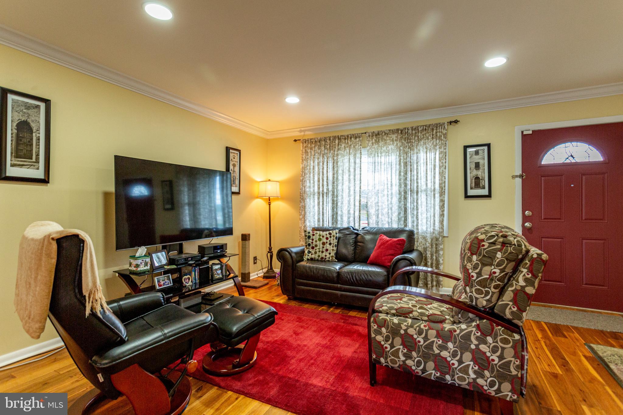 1619 West County Line Road Hatboro, PA 19040 - Photo 3 of 30 a living room with furniture and a flat screen tv