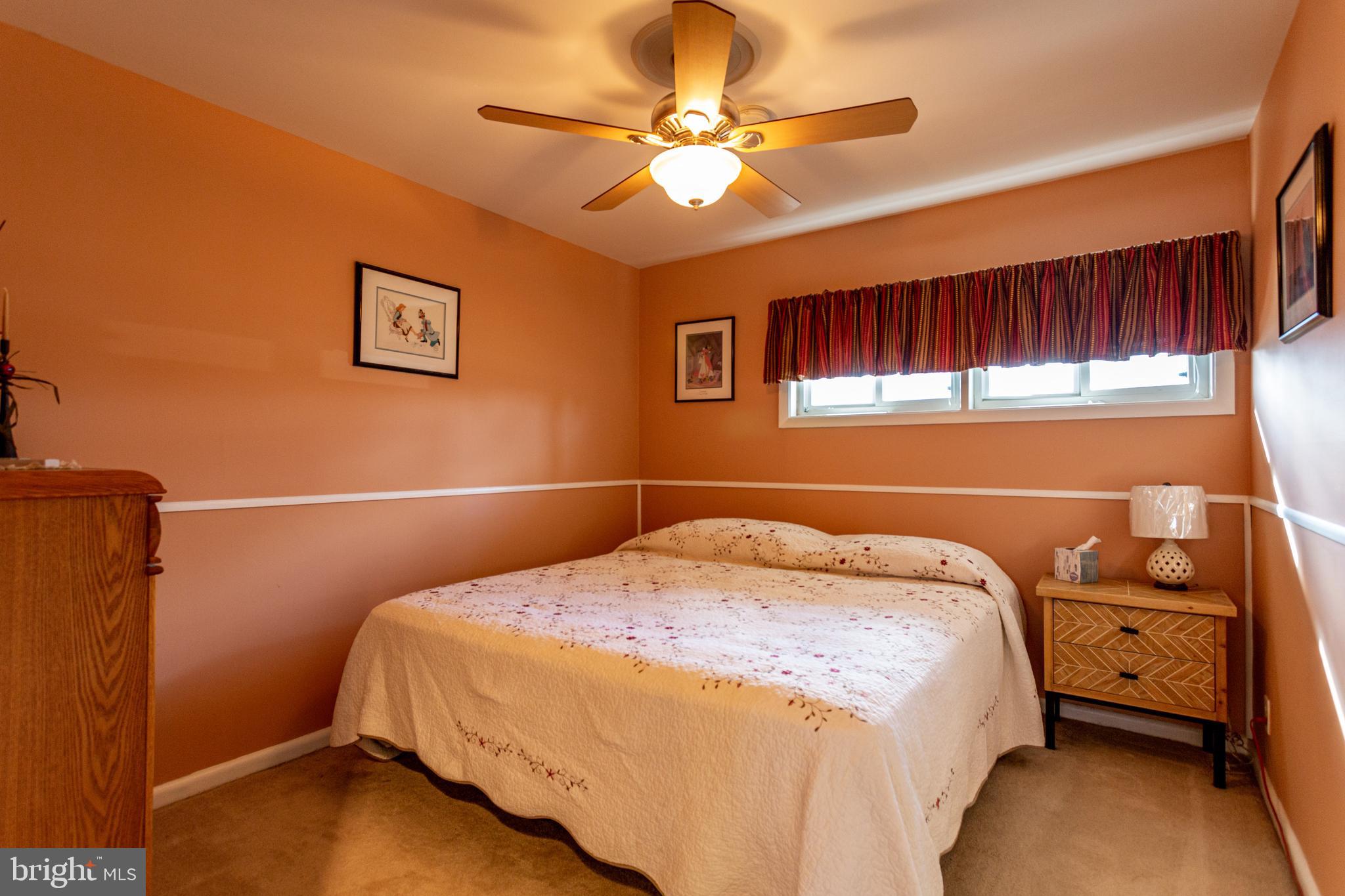 1619 West County Line Road Hatboro, PA 19040 - Photo 23 of 30 a bedroom with a bed and a ceiling fan