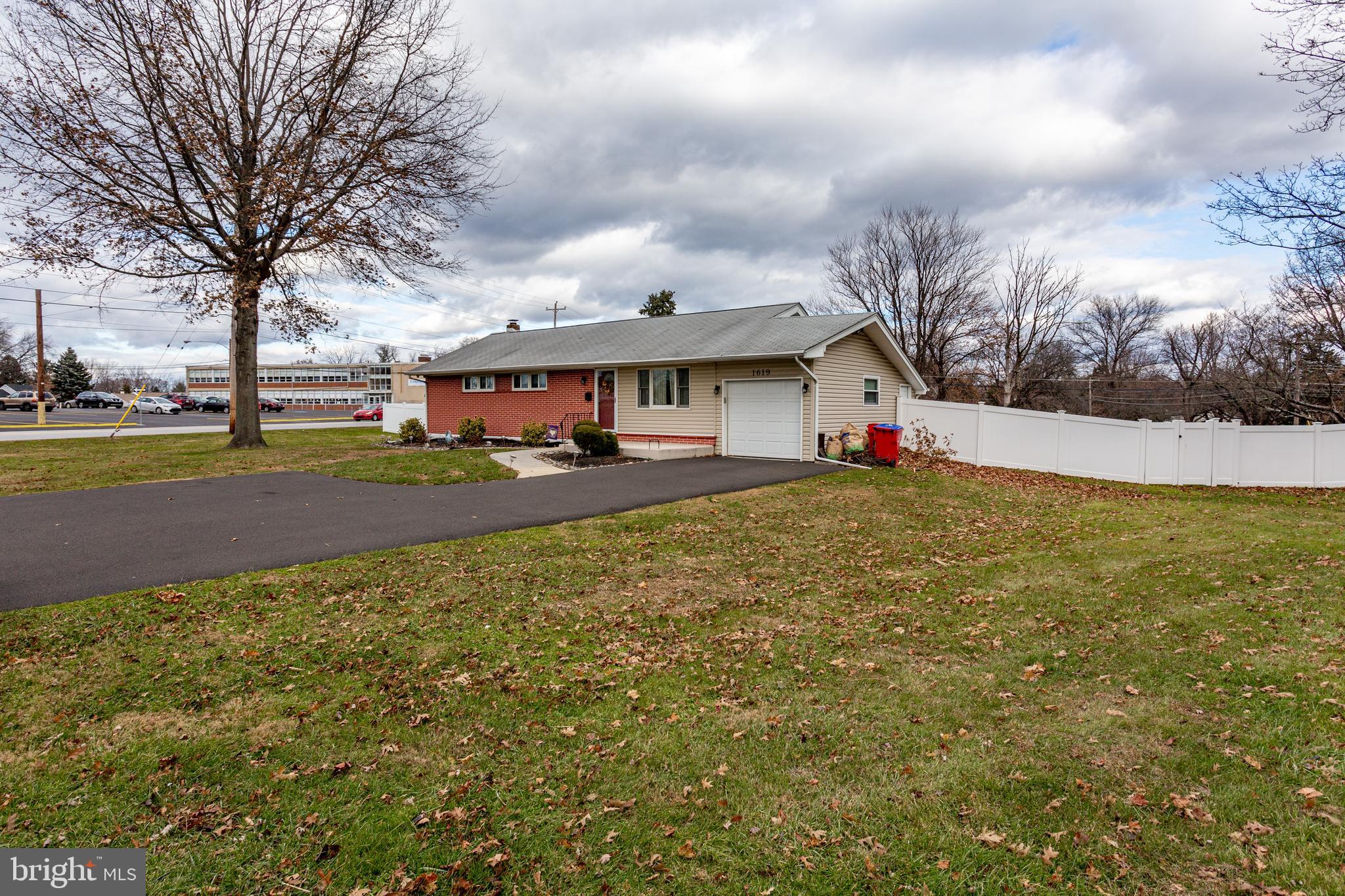 1619 West County Line Road Hatboro, PA 19040 - Photo 28 of 30 a front view of house with yard and trees around