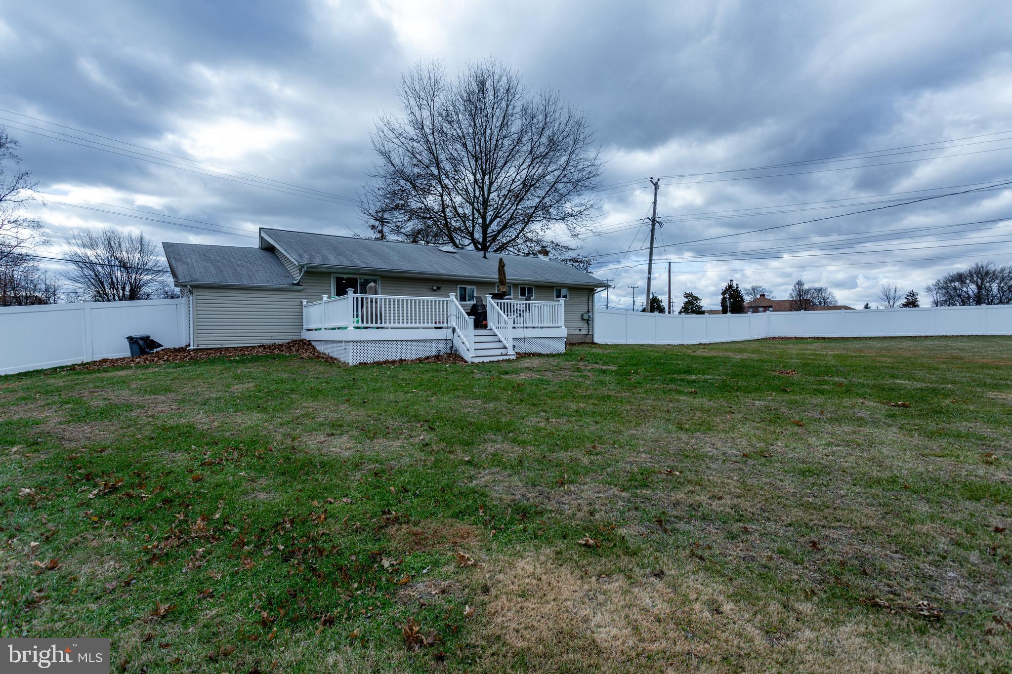 1619 West County Line Road Hatboro, PA 19040 - Photo 30 of 30 a view of a house with a big yard and a large tree