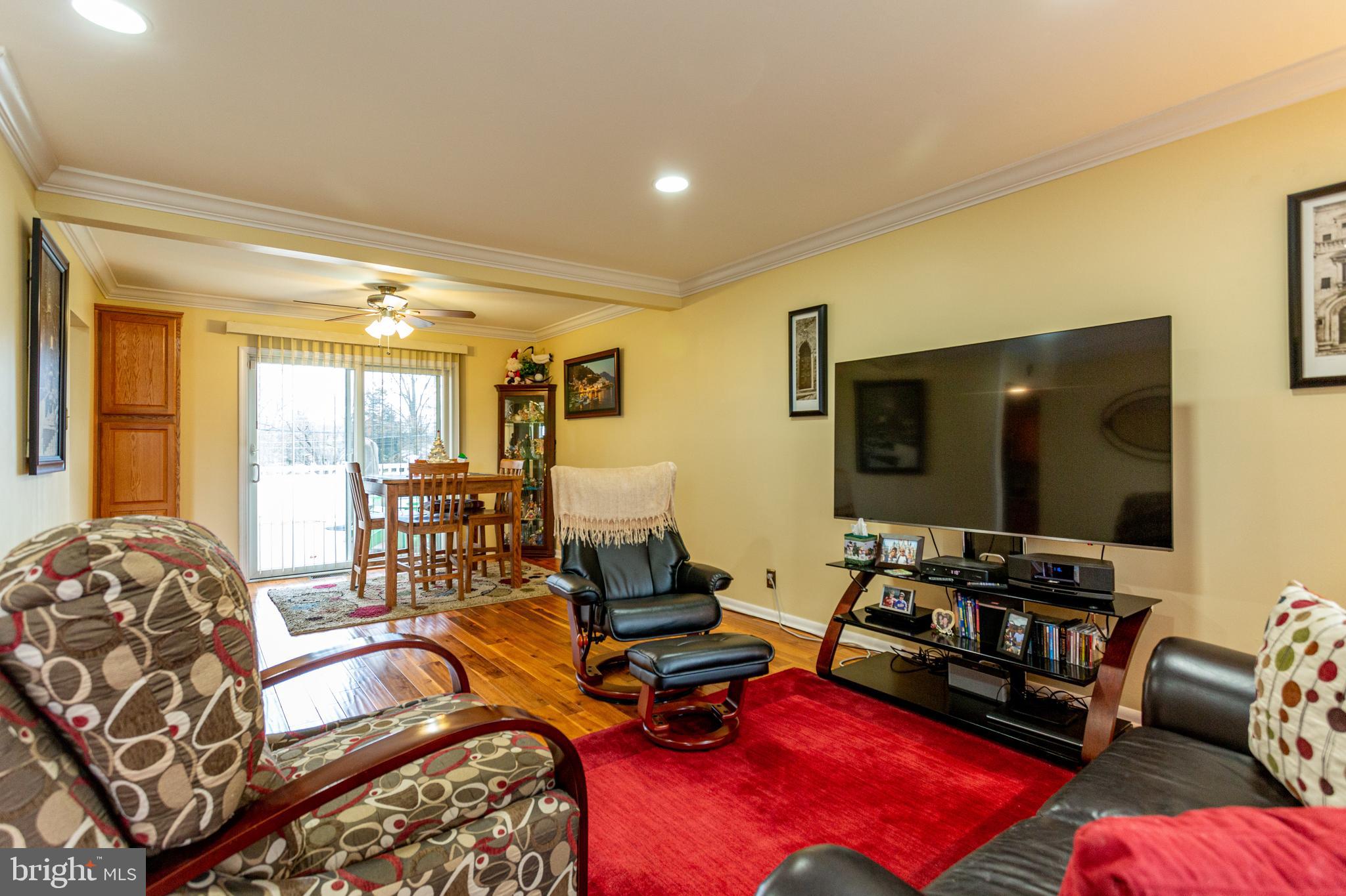 1619 West County Line Road Hatboro, PA 19040 - Photo 4 of 30 a room with gym equipment and a flat screen tv