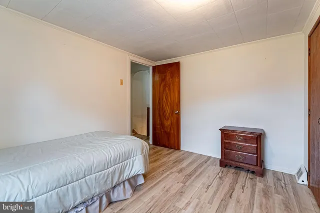 a bedroom with a bed and a cabinets