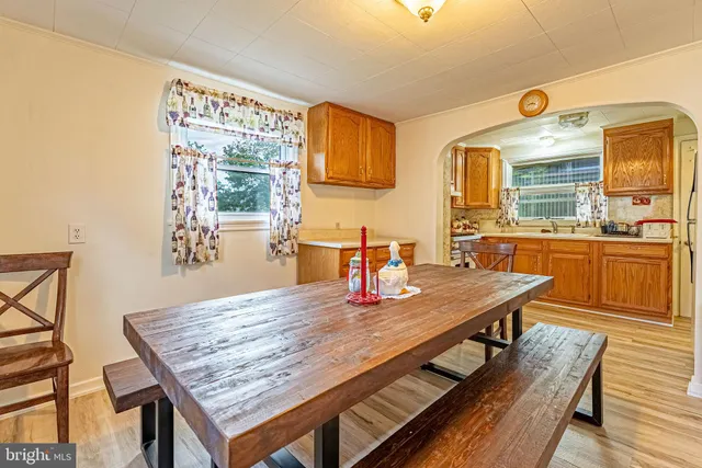 a dining room with a table and chairs in it