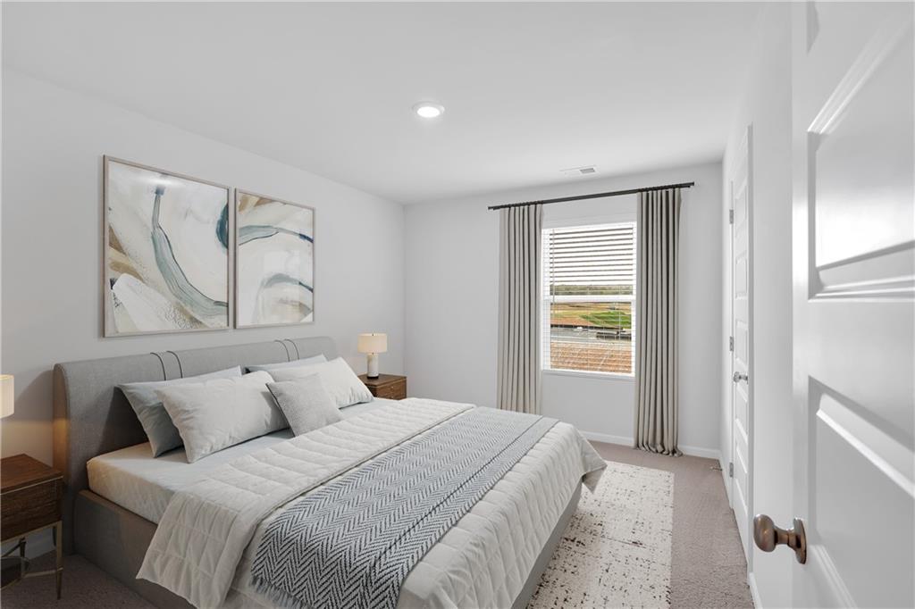 107 Lavender Circle Calhoun, GA 30701 - Photo 12 of 23 a bedroom with a large bed and a window