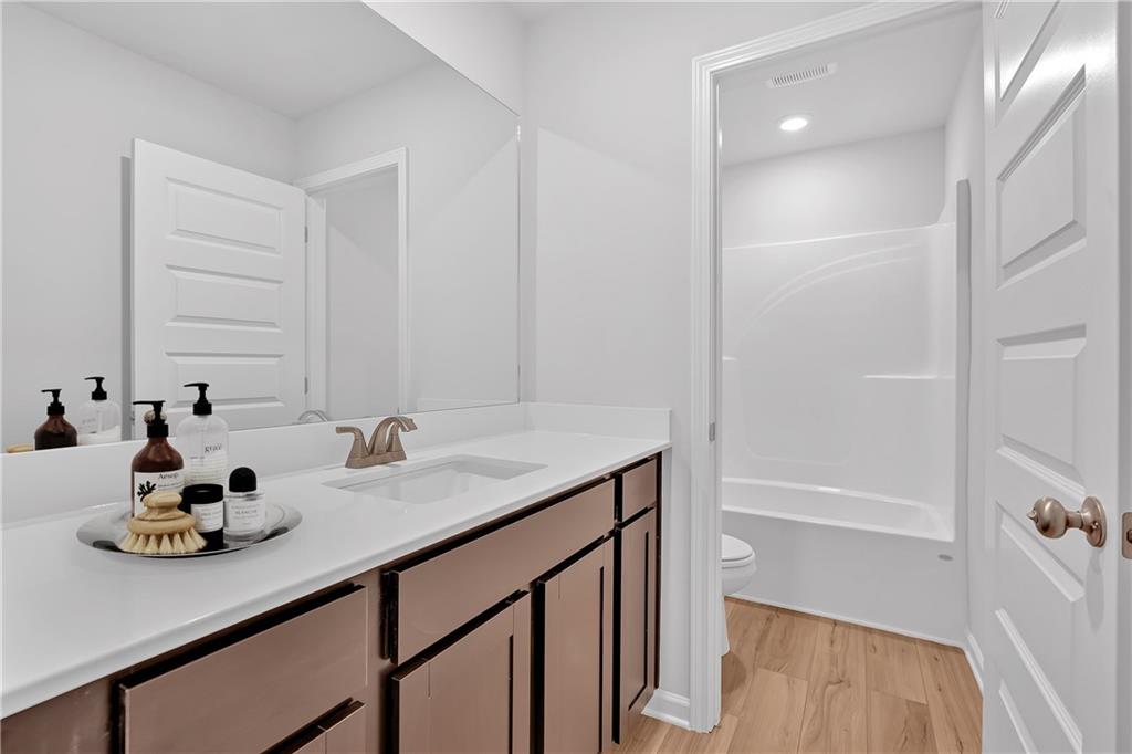 107 Lavender Circle Calhoun, GA 30701 - Photo 14 of 23 a bathroom with a sink and a mirror