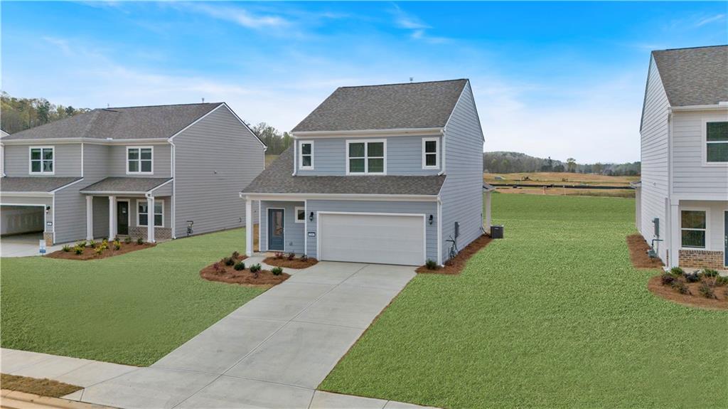 107 Lavender Circle Calhoun, GA 30701 - Photo 2 of 23 a front view of house with yard and outdoor seating