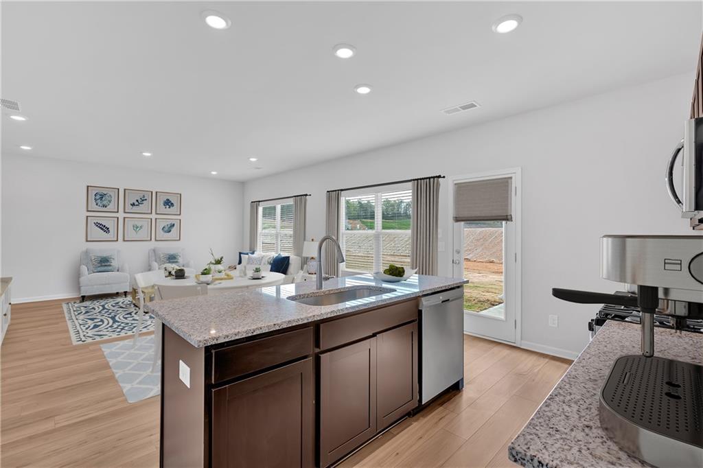 107 Lavender Circle Calhoun, GA 30701 - Photo 9 of 23 a living room with granite countertop furniture and a wooden floor
