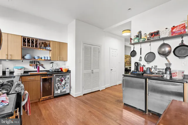 a view of kitchen and sink with wooden floor