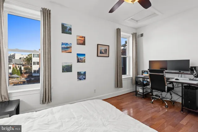 a bedroom with a workspace