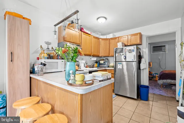 a kitchen with a refrigerator and a sink