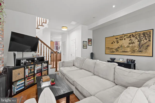 a living room with furniture and a flat screen tv