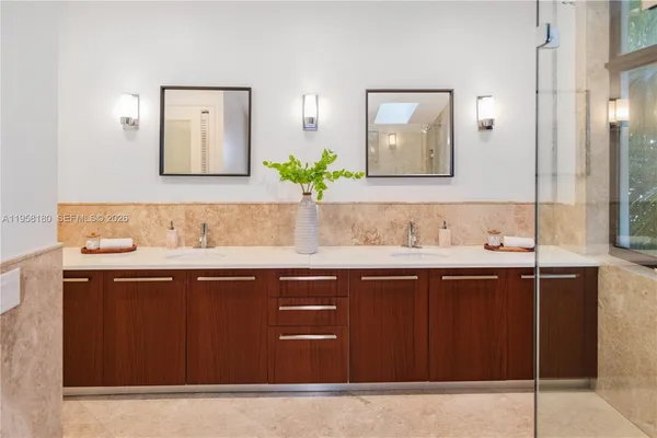 a sink with wooden cabinets