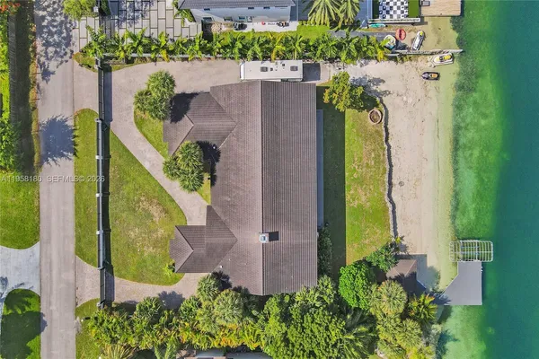 an aerial view of a house with a garden