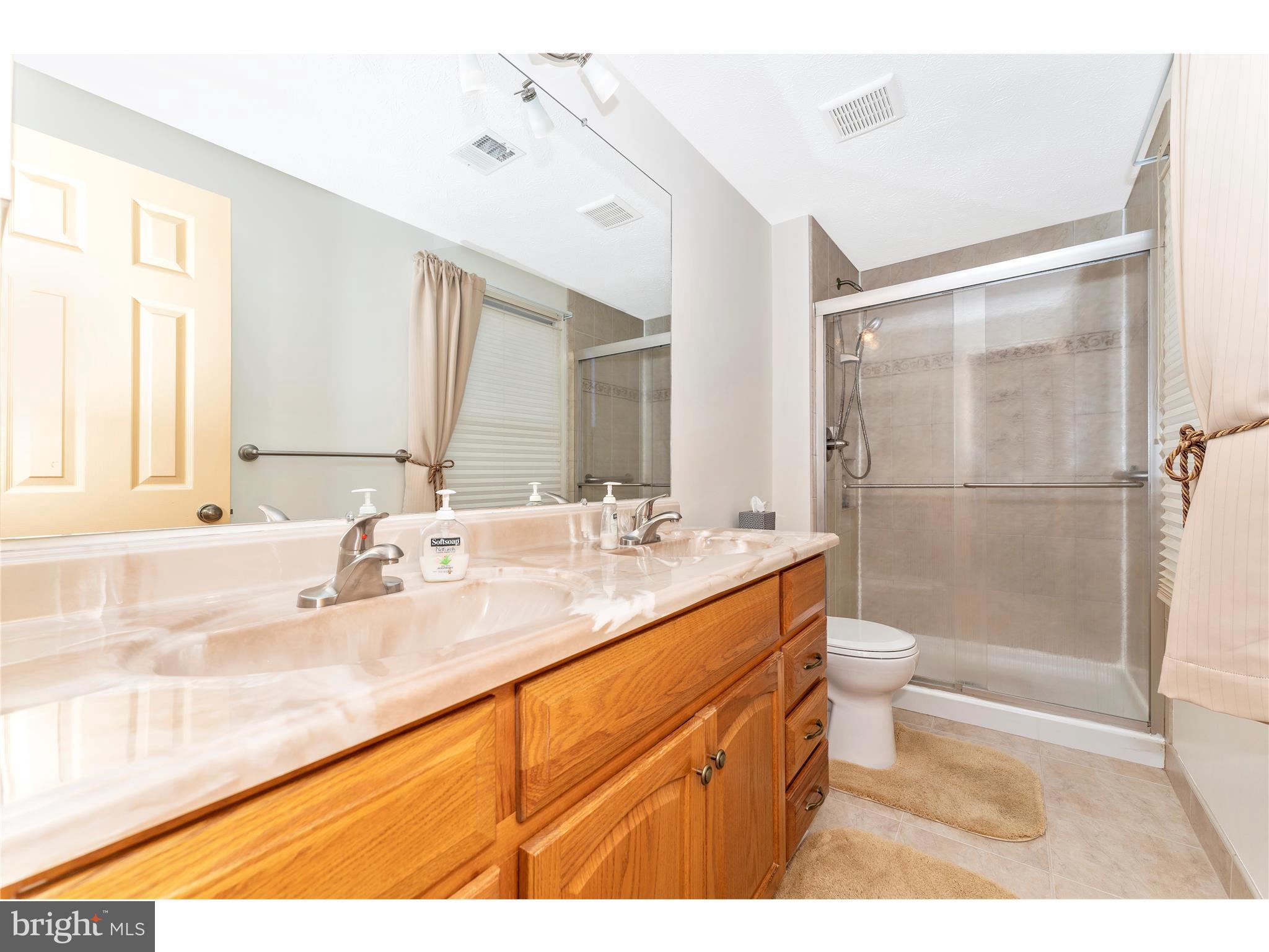 595 Pumphouse Road Frederick, MD 21703 - Photo 26 of 50 Master with updated shower and double sinks