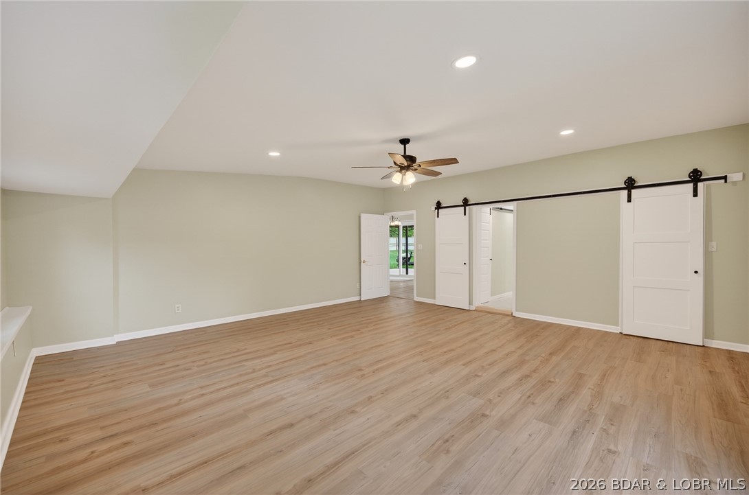 177 Storage Road Eldon, MO 65026 - Photo 15 of 34 Private En Suite: Barn doors slide open to reveal