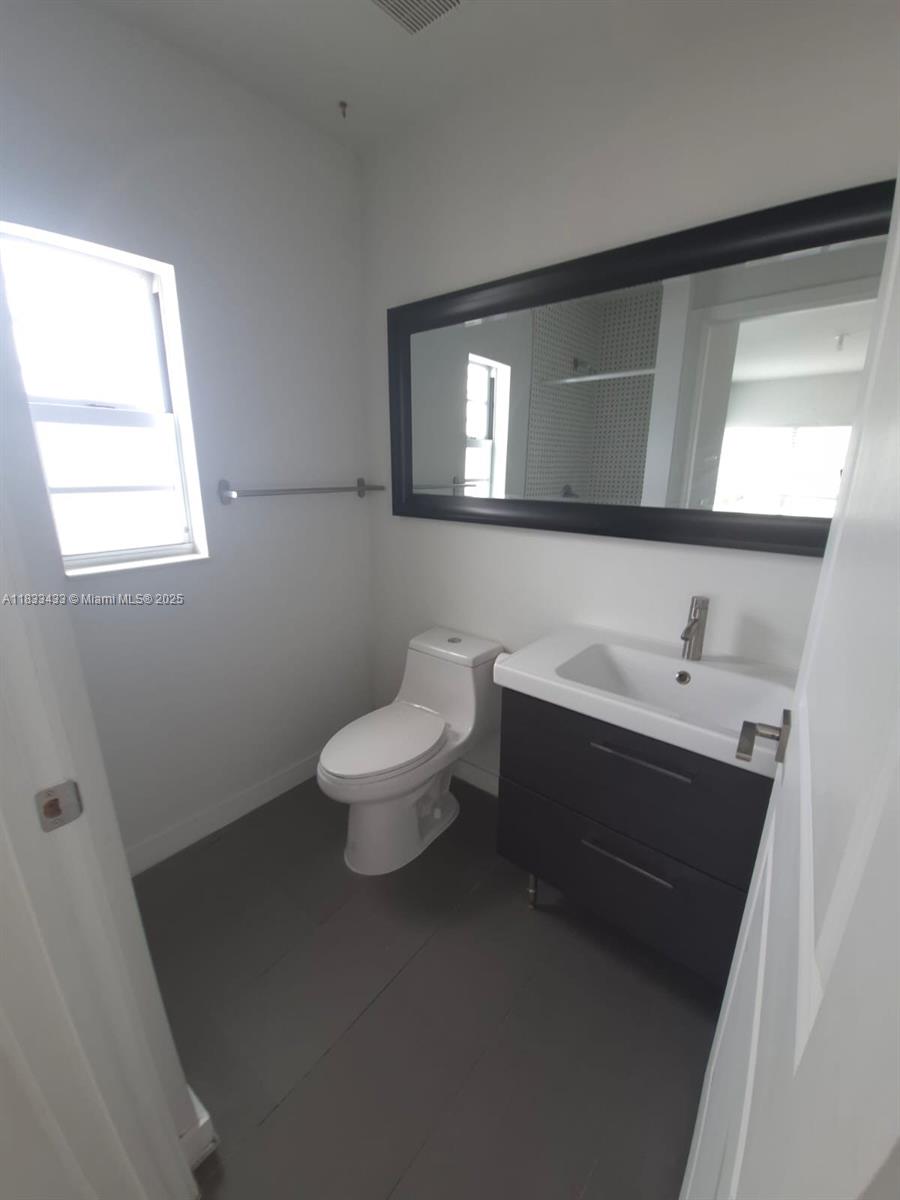 1211 Euclid Avenue, Unit 11 Miami Beach, FL 33139 - Photo 12 of 19 a bathroom with a sink and a toilet
