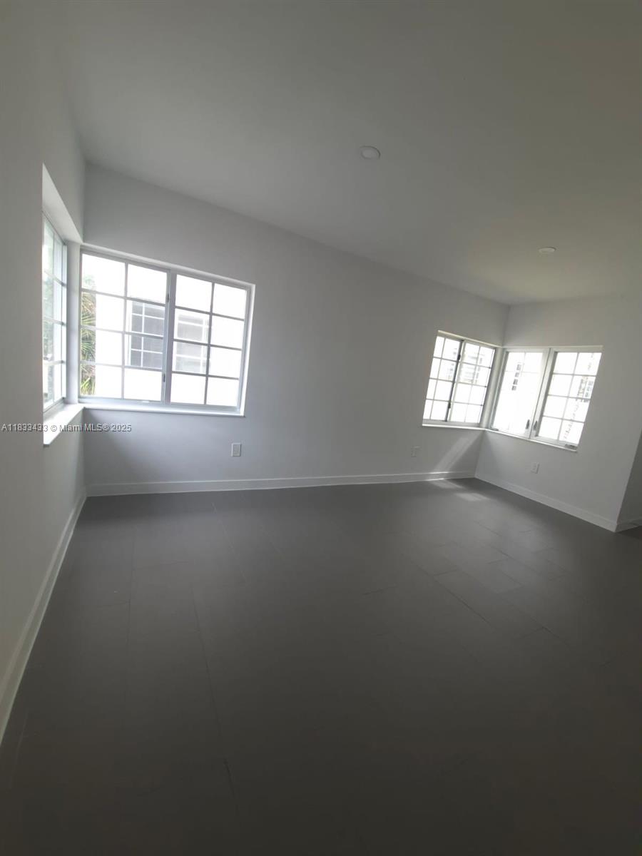 1211 Euclid Avenue, Unit 11 Miami Beach, FL 33139 - Photo 3 of 19 an empty room with windows