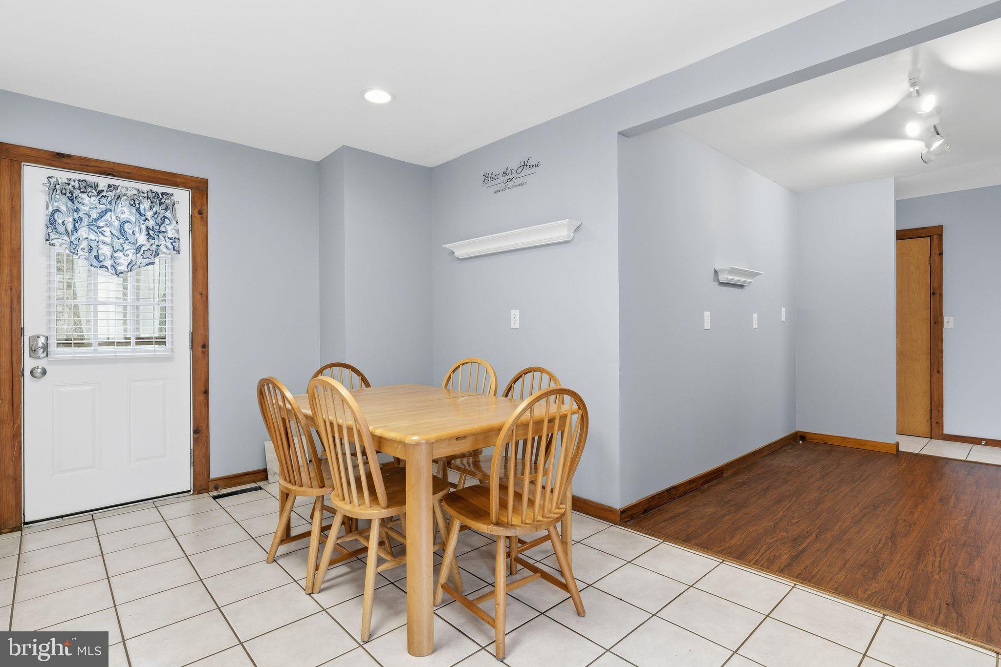 453 Lost Valley Road Madison, VA 22727 - Photo 16 of 54 a view of a dining room with furniture and wooden floor