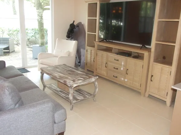 a living room with furniture and a window